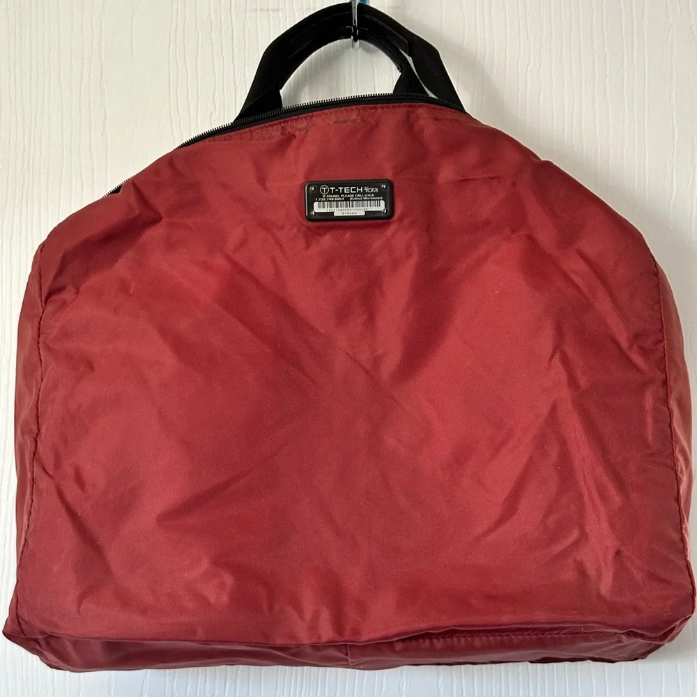 Vintage Tumi laptop/crossbody bag. Black with red lining, great find!